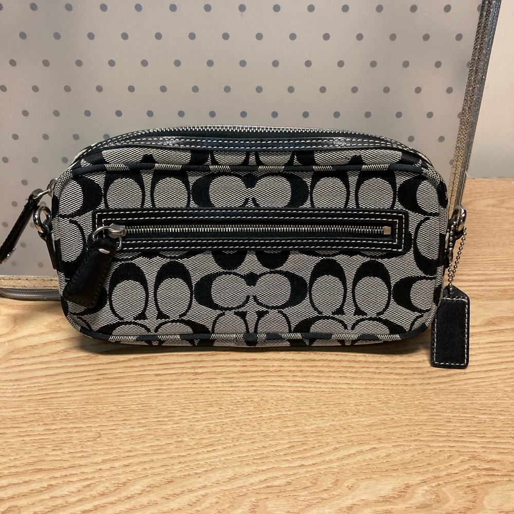 Coach. Nwot .  Will supply cloth strap.